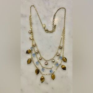 18” brass necklace with tiger eye, black pearl, and blue topaz